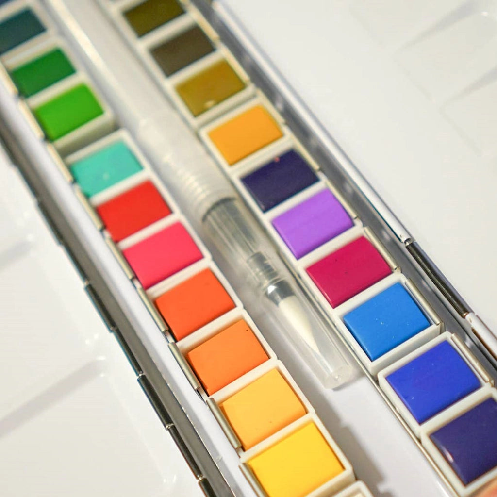 24 Color Watercolor Palette paint set available from Campanula Design Studio in Seattle. Pair this with some of our watercolor books and cards, add a flower arrangement, or a gift basket.