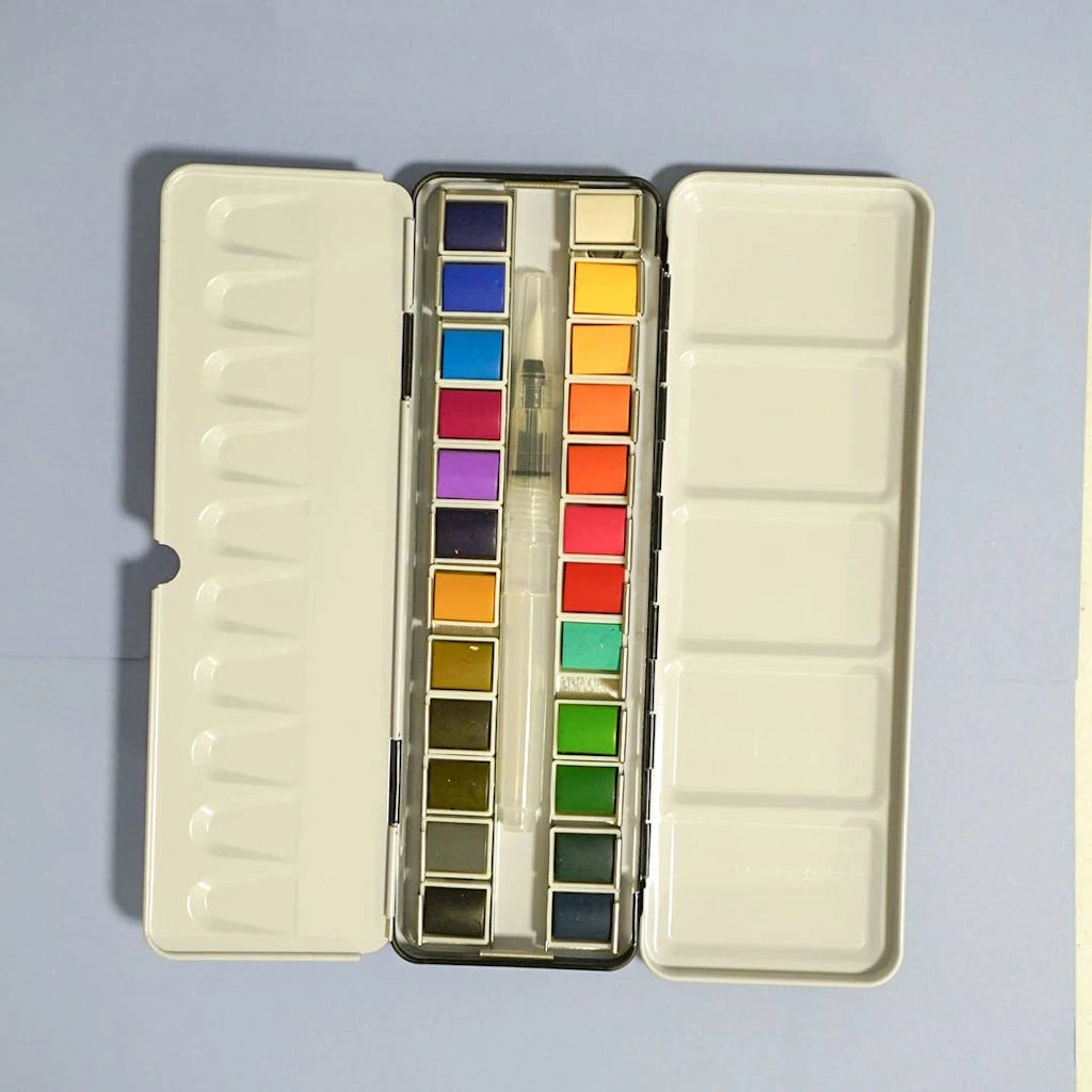 24 Color Watercolor Palette paint set available from Campanula Design Studio in Seattle. Pair this with some of our watercolor books and cards, add a flower arrangement, or a gift basket.