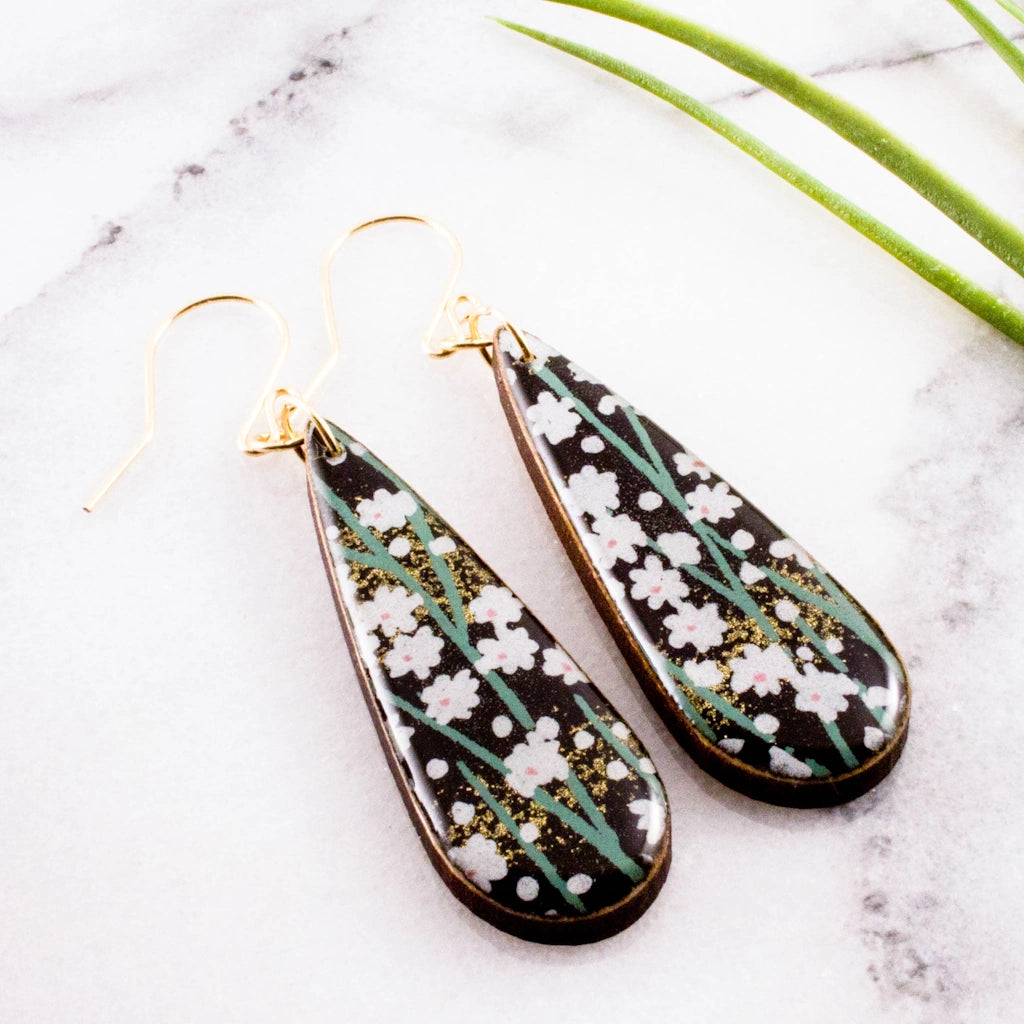 These Black Daisy Teardrop Earrings are available from Campanula Design Studio in Magnolia, Seattle.