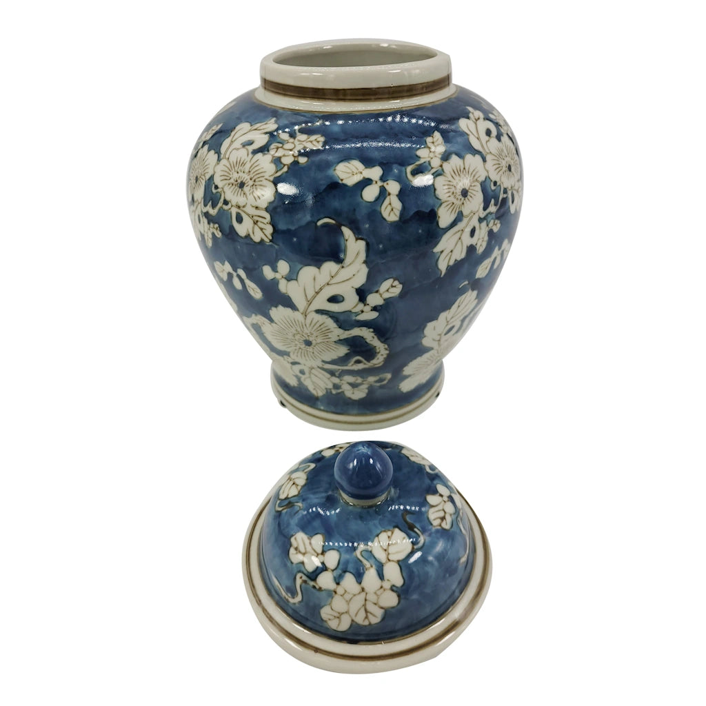 Blue and white blossoming and trailing tree branches chinoiserie print vase is so unique in its gourd design that it stands out no matter what its use or what room it is being used in. Featuring a floral design with blue and white, its sure to bring in the classic French and Asian designs back into style. 