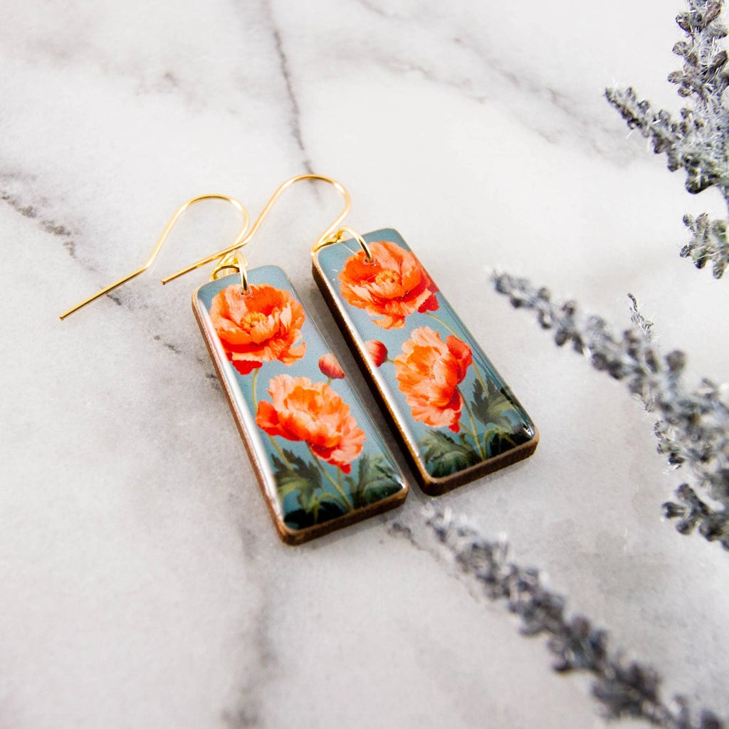 These beautiful blood orange poppy flower earrings area available for nationwide shipping, in-store pickup from out Magnolia gifts and flower shop, or delivery in the greater Seatle area.