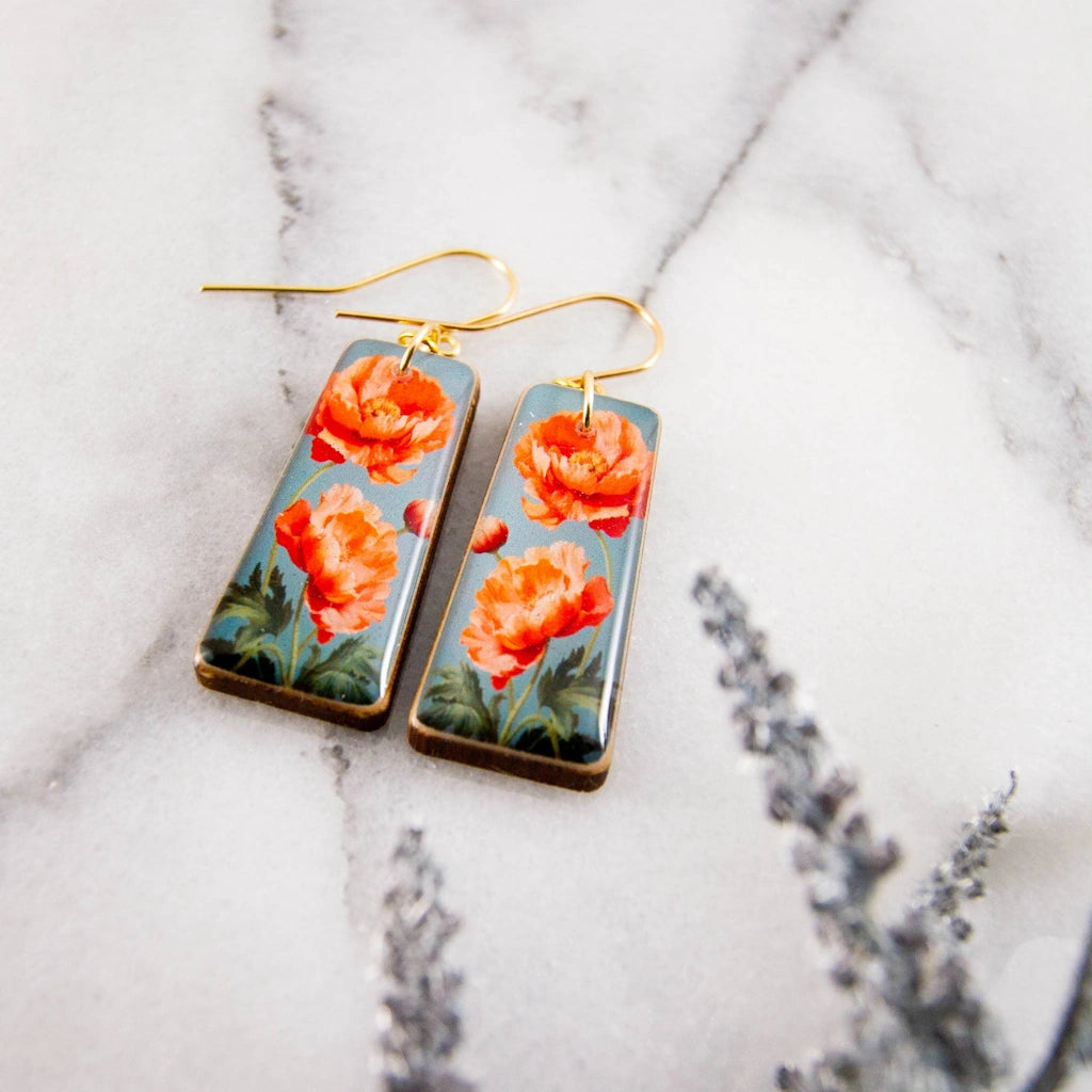 These beautiful blood orange poppy flower earrings area available for nationwide shipping, in-store pickup from out Magnolia gifts and flower shop, or delivery in the greater Seatle area.