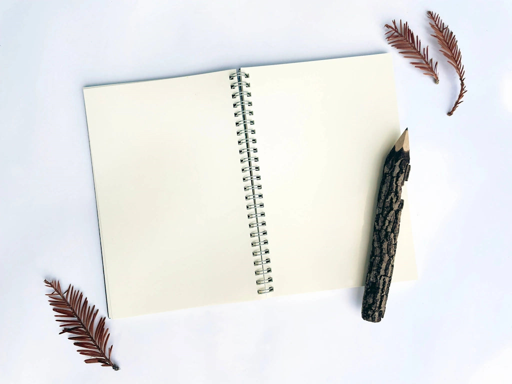 Keep your gardening notes organized in style with these tidy, handy spiral-bound notebooks, foil pressed in gold with a row of five sweet potted plants. Available from Campanula Design Studio, Seattle's premier gift shop and florist.