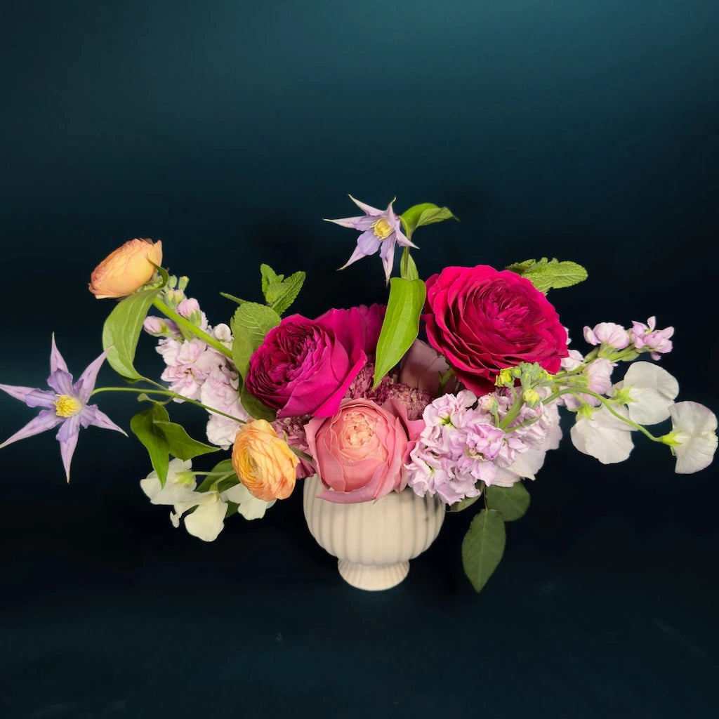 Kaleidoscope is a beautiful multi-hued design of seasonally inspired florals gathered in a ceramic compote. Give your friend or loved one this gorgeous bouquet for Valentine's Day, or consider adding on some wine, chocolate, or other gifts from our selection of creative and unique gifts.