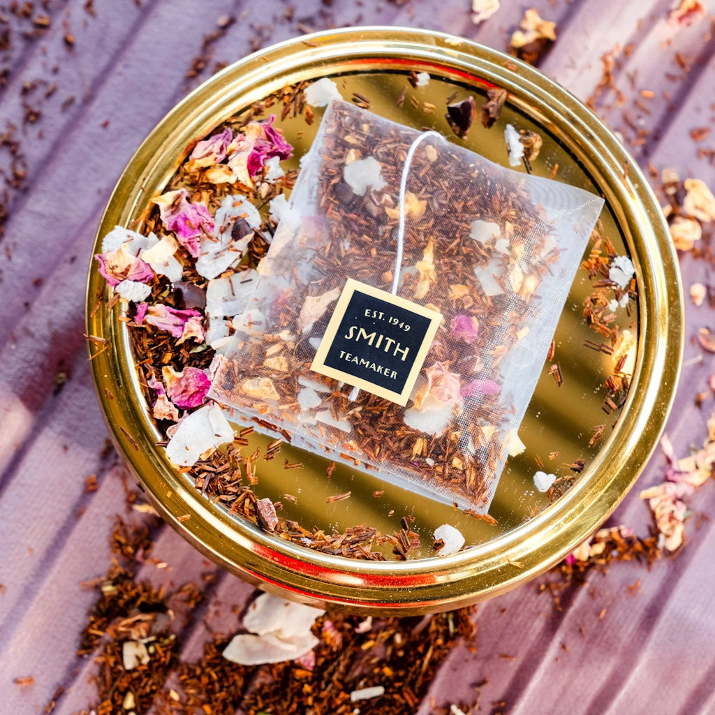 Kissmet by Smith Teamaker is A rich, romantic blend of nicely rounded rooibos, coconut, pink rose petals and soft, silky chai spices. Available from Campanula Design Studio in Seattle.