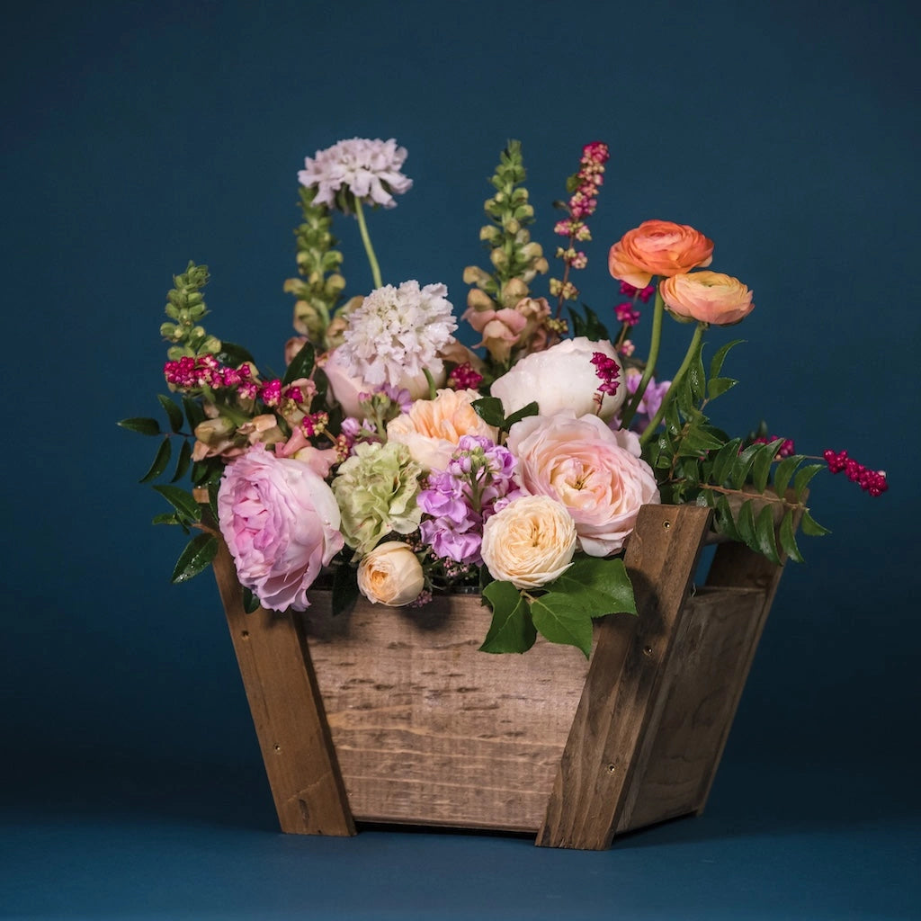 This floral gift basket is perfect for the holidays as a gift for as a bright decoration for your holiday table.