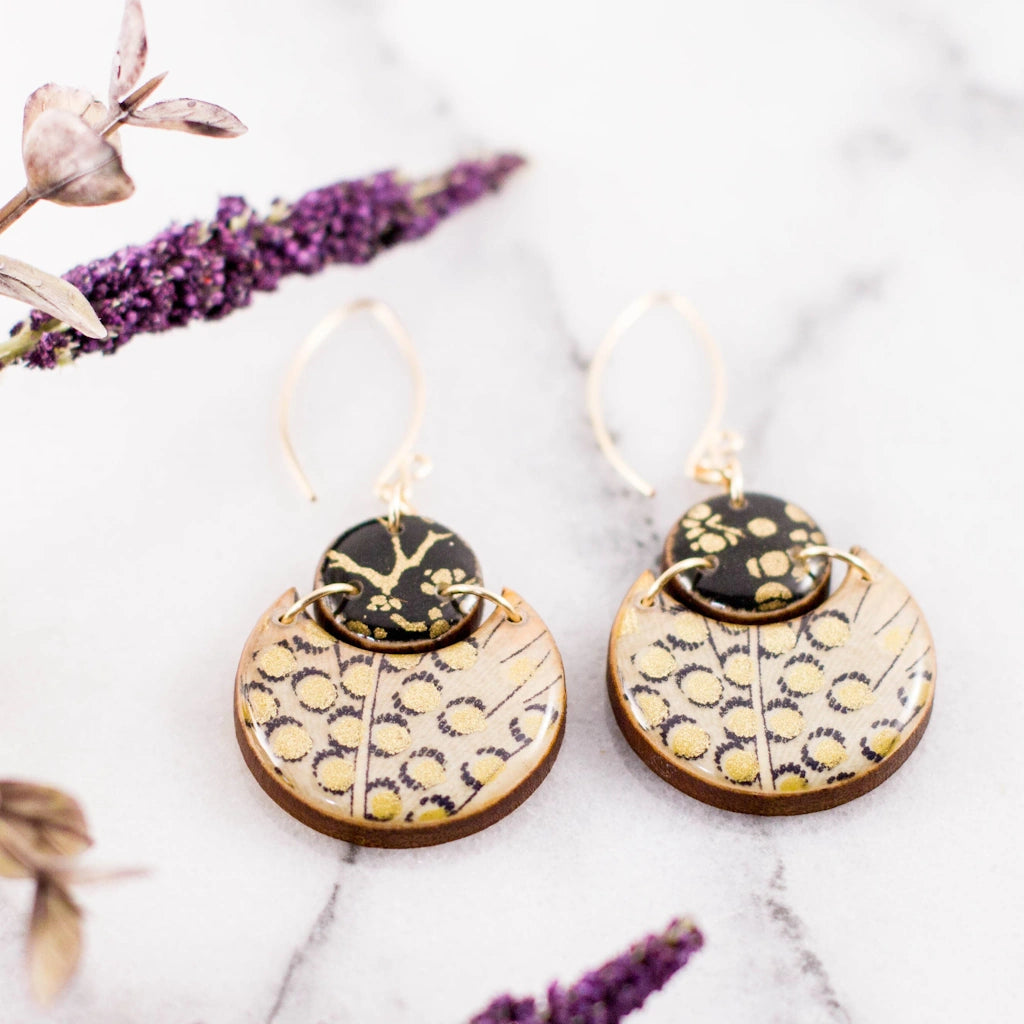 These Metallic Feather Double Circle Earrings are available from Seattle's best florist, Campanula Design Studio in Seattle for nationwide shipping, pr combine them with one of our flower arrangements, gift baskets, or houseplants for the perfect gift for Seattle area delivery.