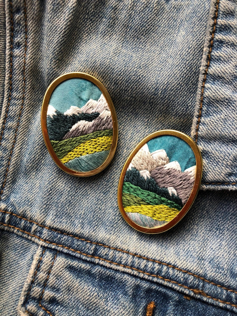 Give the gift of crafting to your crafty friend. This embroidery kit lets you create your own oval landscape pin. Available from Campanula Design Studio in Seattle.