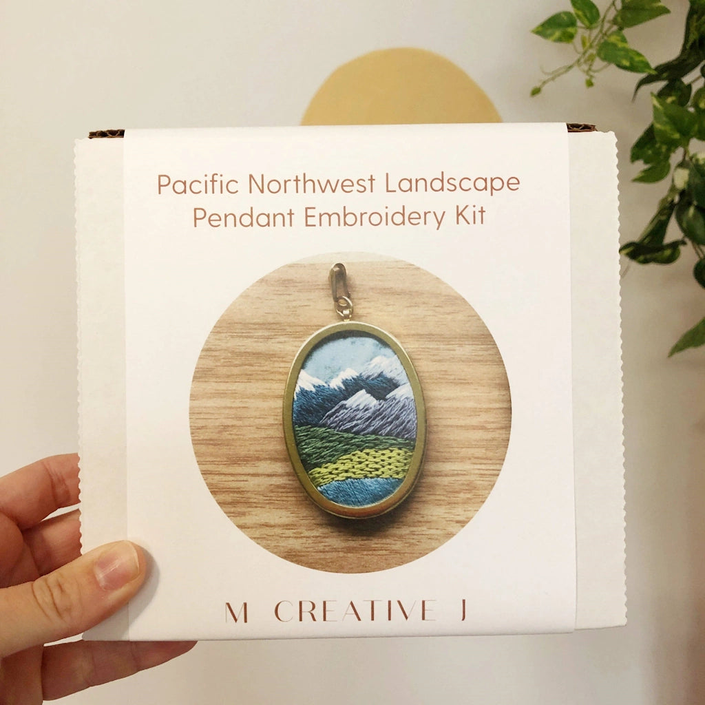 Give the gift of crafting to your crafty friend. This embroidery kit lets you create your own oval landscape pin. Available from Campanula Design Studio in Seattle.