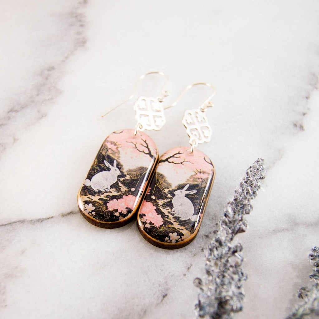 From Campanula Design Studio: these "Pastel Pink Rabbit Oblong Earrings" make the perfect git for yourself or your jewelry loving friend. Nationwide shipping, pick up in Magnolia, or have them delivered with a floral arrangement for the perfect Jewelry and Flowers gift.