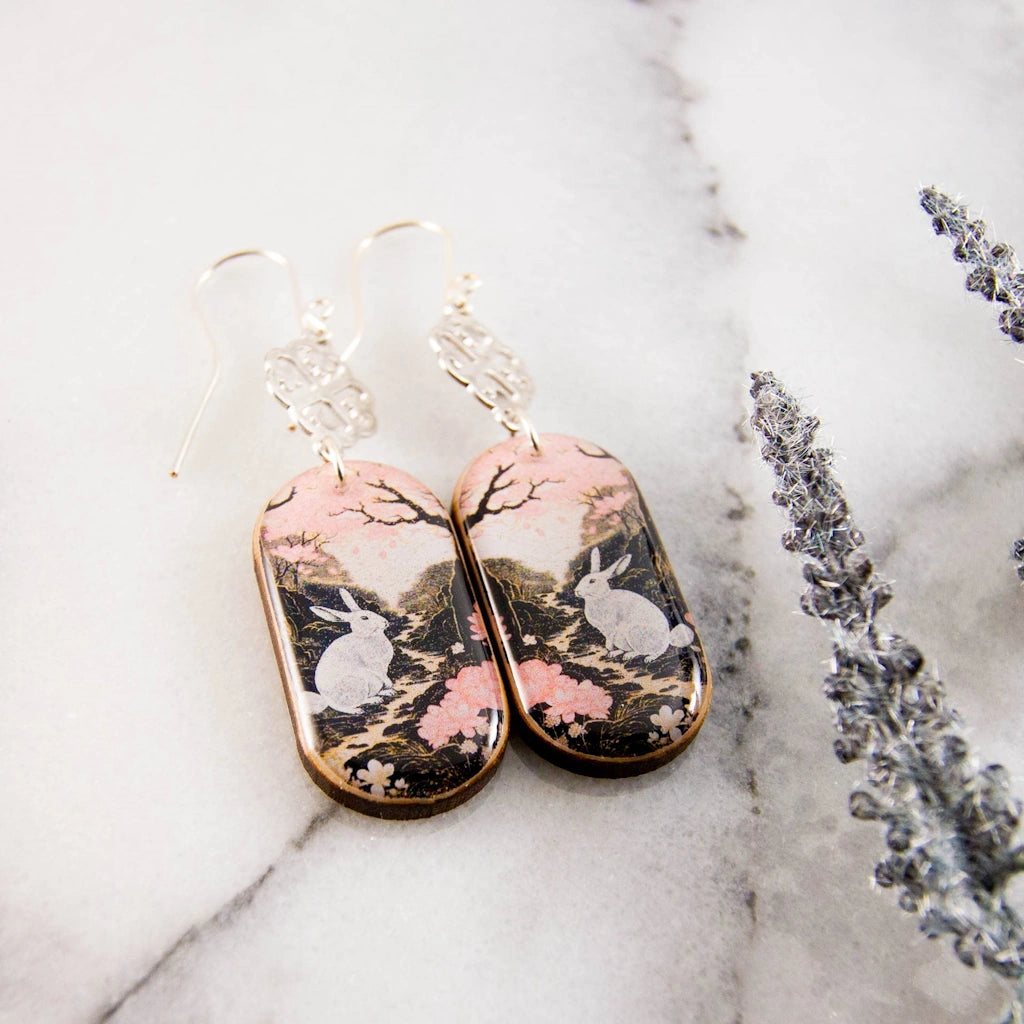 From Campanula Design Studio: these "Pastel Pink Rabbit Oblong Earrings" make the perfect git for yourself or your jewelry loving friend. Nationwide shipping, pick up in Magnolia, or have them delivered with a floral arrangement for the perfect Jewelry and Flowers gift.