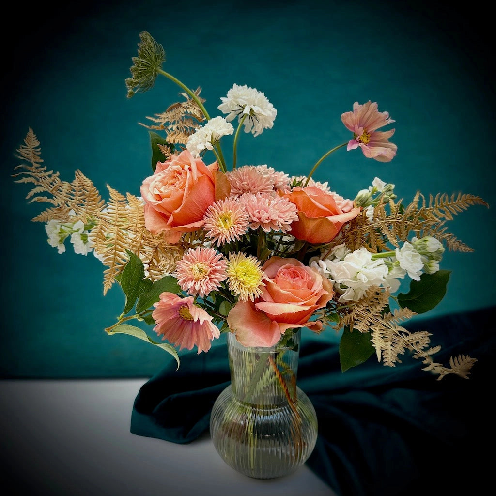 Our "Peach Cobbler" floral arrangment features soft peaches, pinks, and creamy whites in a clear glass vessel. Available from Campanula Design Studio in Seattle, WA.