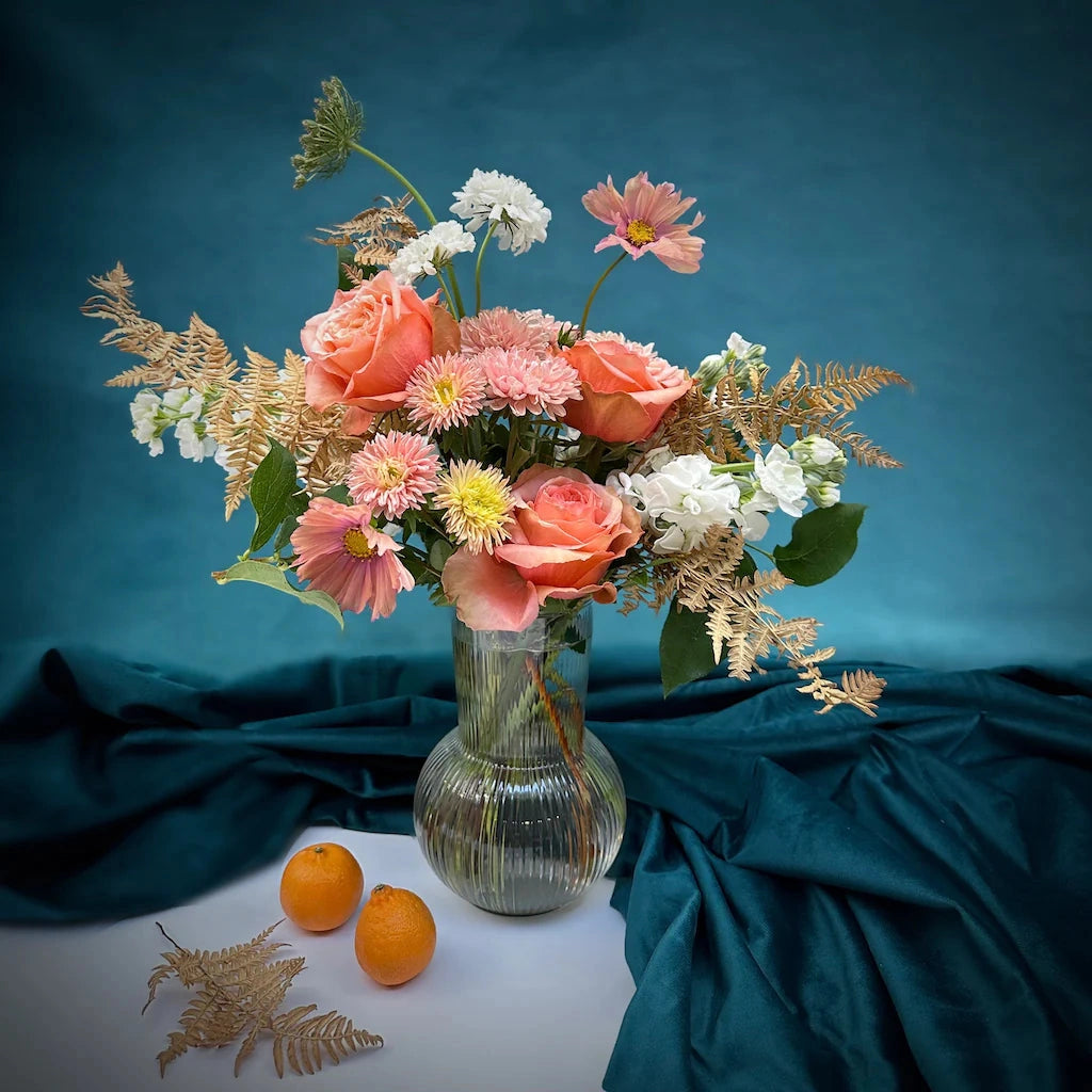 Our "Peach Cobbler" floral arrangment features soft peaches, pinks, and creamy whites in a clear glass vessel. Available from Campanula Design Studio in Seattle, WA.