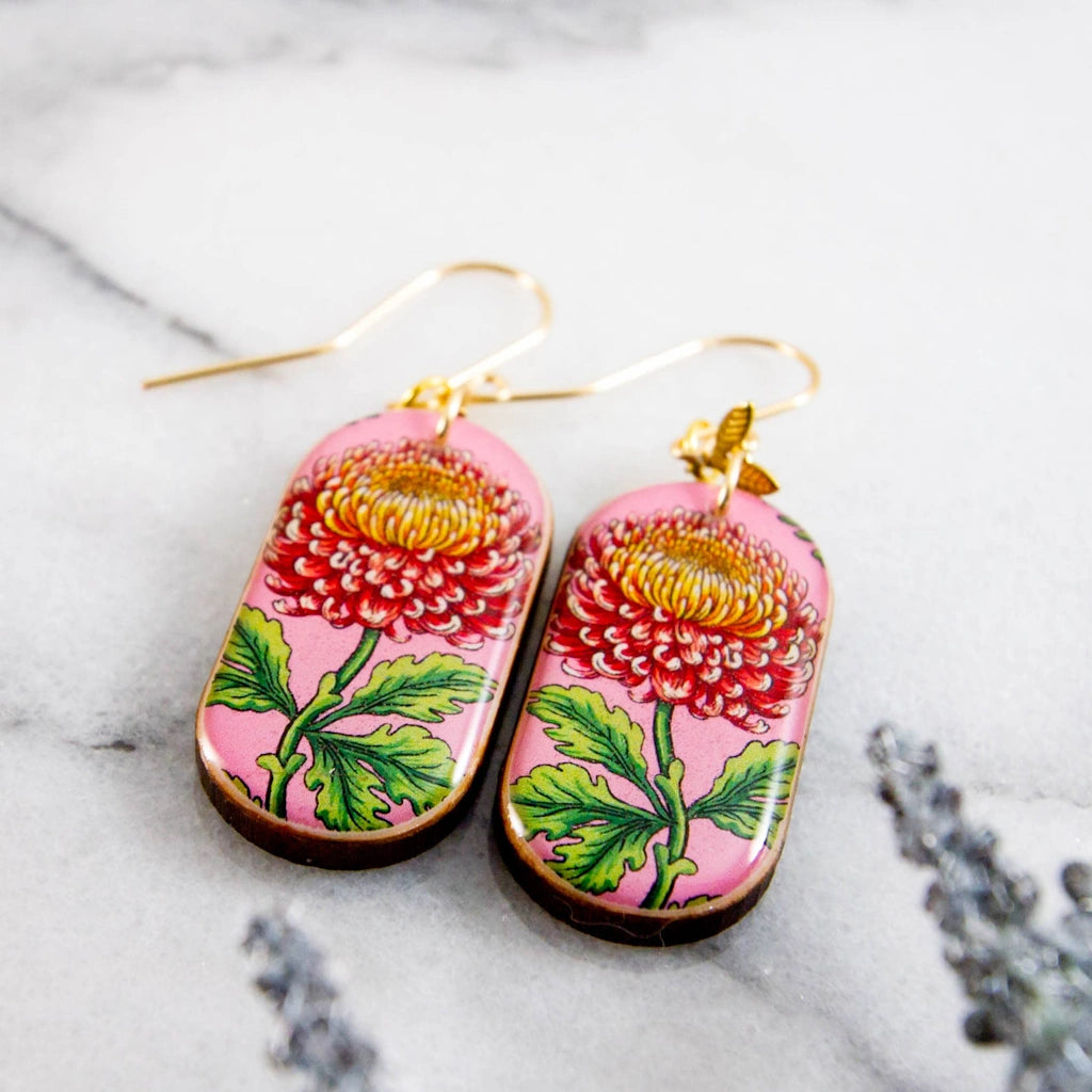 These charming earrings are a celebration of spring! Featuring a vintage inspired chrysanthemum flower illustration, rendered in shades of pink, yellow, and green. Available from Seattle flower and gift shop, Campanula Design Studio in the Magnolia neighborhood. Pickup or ship nationwide!