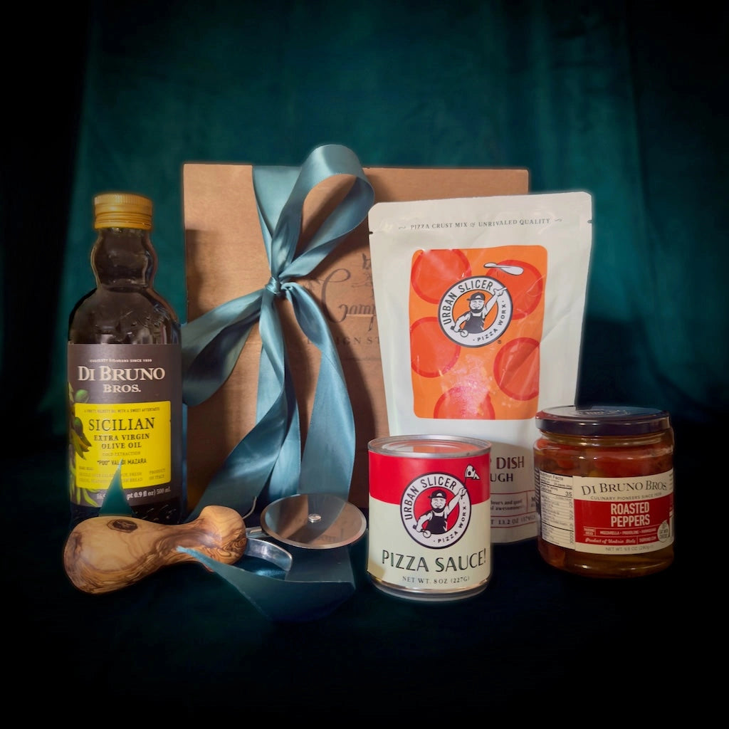 Holiday gift box perfect for your pizza loving friend. Featuring:
Urban Slicer pizza dough
One can of pizza sauce
Olive wood handle pizza cutter
Jar of roasted peppers
Sicilian olive oil

Available for nationwide shipping from Campanula Design Studio.