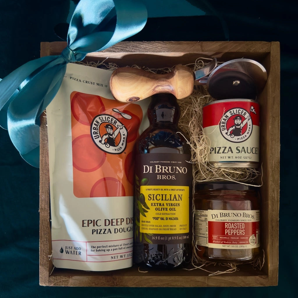 Holiday gift box perfect for your pizza loving friend. Featuring:
Urban Slicer pizza dough
One can of pizza sauce
Olive wood handle pizza cutter
Jar of roasted peppers
Sicilian olive oil

Available for nationwide shipping from Campanula Design Studio.