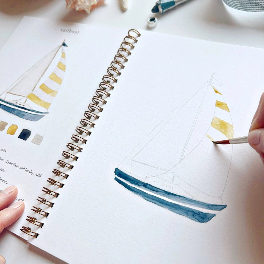 The Seaside Watercolor Workbook includes 12 coastal-themed illustrations with an example of the finished painting, step-by-step instructions, and a lightly illustrated sketch for you to paint. Available from Seattle gift shop, Campanula Design Studio in Magnolia. Purchase on its own for nationwide shipping, or combine with a gift basket, floral arrangment, or houseplant for the perfect gift.