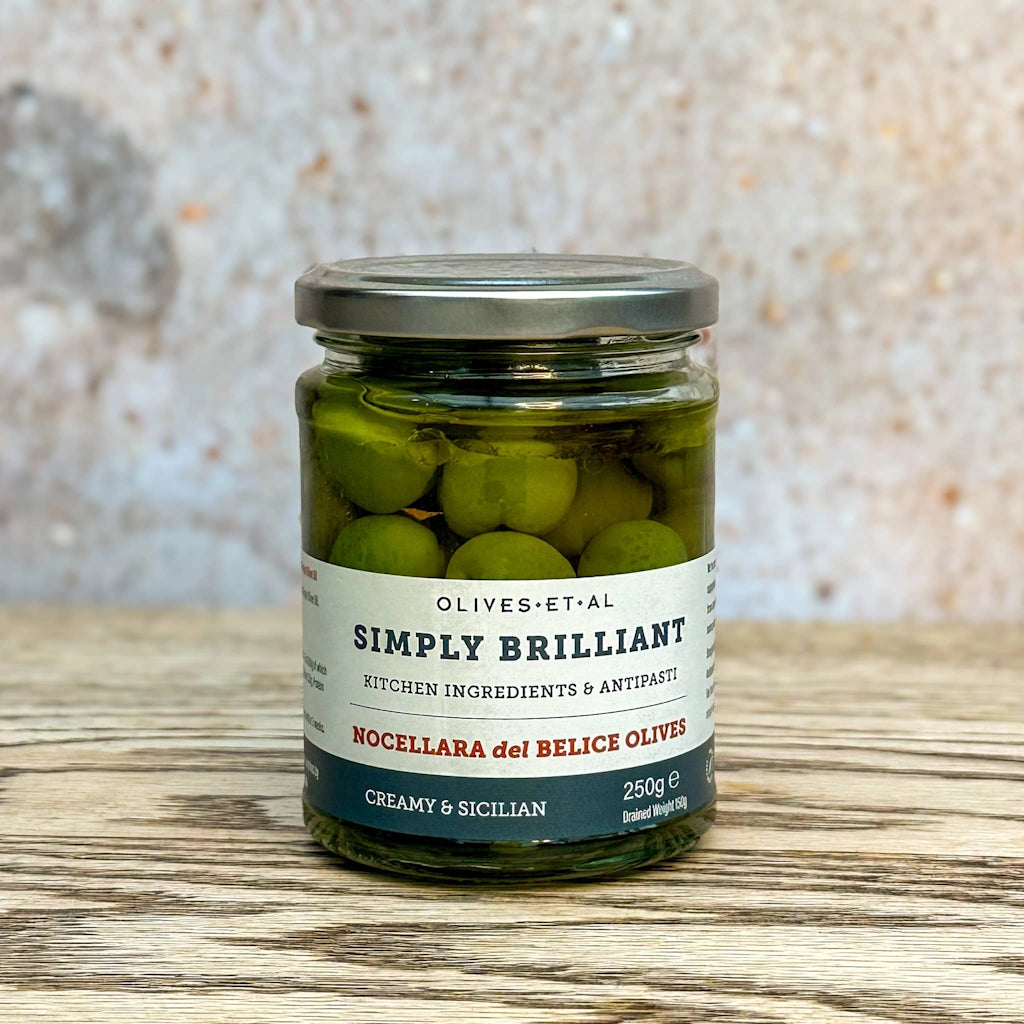 Sicilian Nocellara del Belice Olives in a light brine. Buttery, creamy &amp; sweetly firm, these are the classic Sicilian Olives — perfect to eat just as they are, in a crisp salad, or in a Martini. Available from our gift shop in Magnolia, or shipping natiowide. Consider adding these to one of our gift baskets, flower arrangements, or houseplants for delivery in the greater Seattle area for the perfect gift.