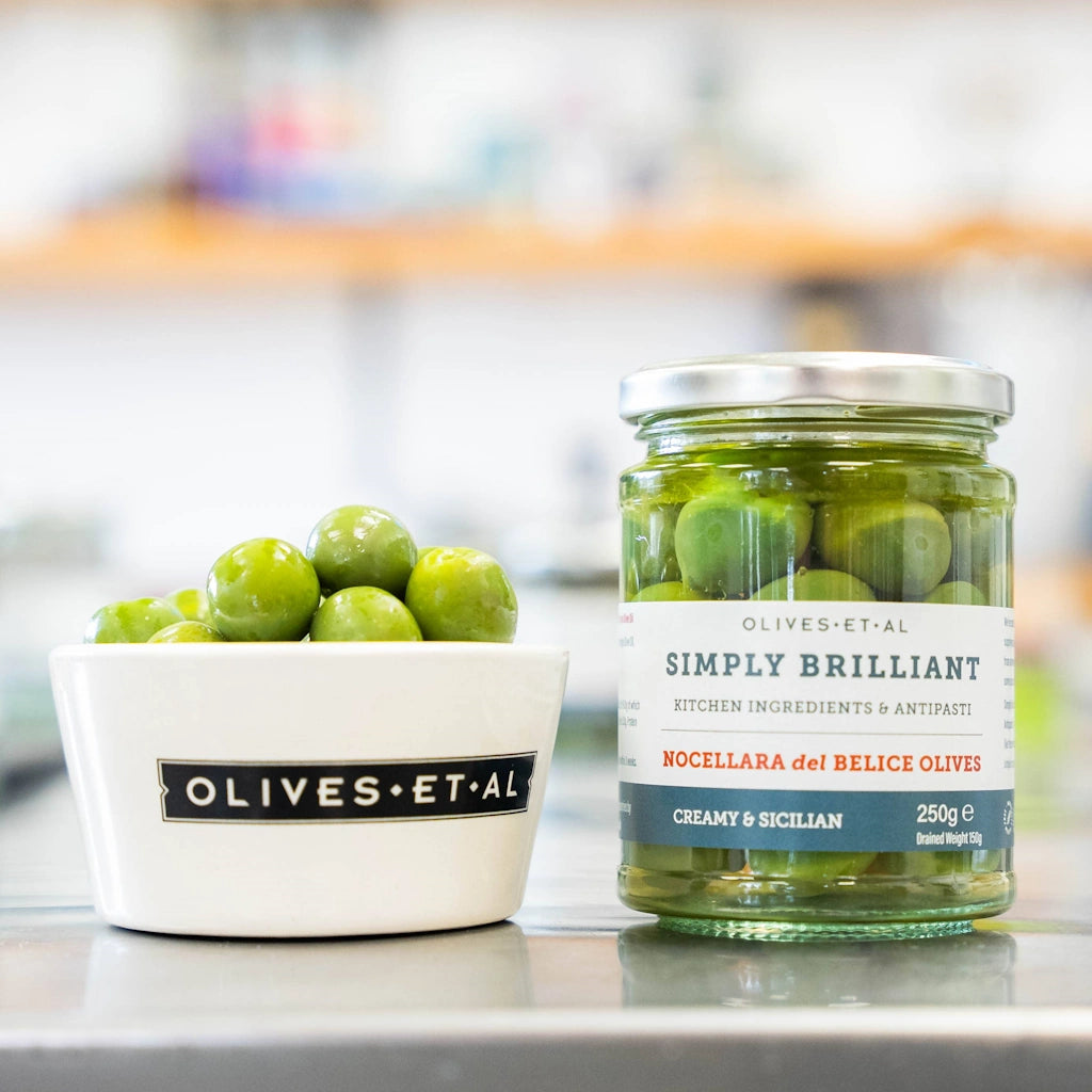 Sicilian Nocellara del Belice Olives in a light brine. Buttery, creamy &amp; sweetly firm, these are the classic Sicilian Olives — perfect to eat just as they are, in a crisp salad, or in a Martini. Available from our gift shop in Magnolia, or shipping natiowide. Consider adding these to one of our gift baskets, flower arrangements, or houseplants for delivery in the greater Seattle area for the perfect gift.