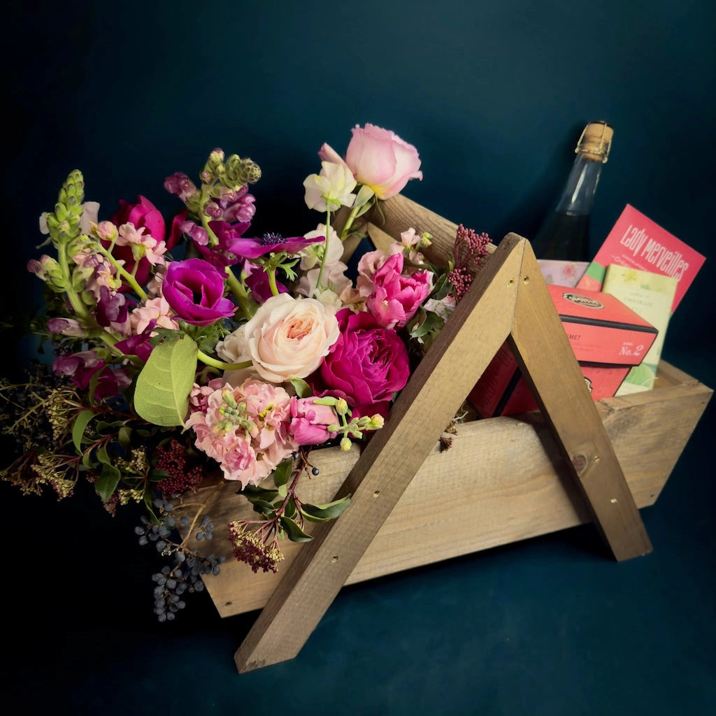 "Strawberry Fields Forever" gift basket is the ultimate Valentine's day gift. Beautiful pink-themed basket with chocolate, rose (alcoholic or non-alcoholic), tea, and shortbread cookies. Delivery in the greater Seattle area or pick up from our gift basket and florist shop in Seattle in the Magnolia neighborhood.