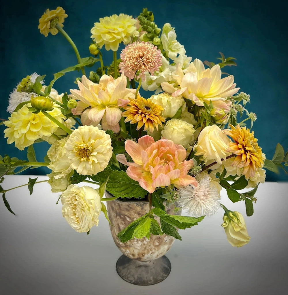 "Sunlight" is our stunning floral arrangement featuring a soft and warm palette of yellow and cream premium blooms mixed with supporting botanicals and textures. Available from Campanula Design Studio in Seattle