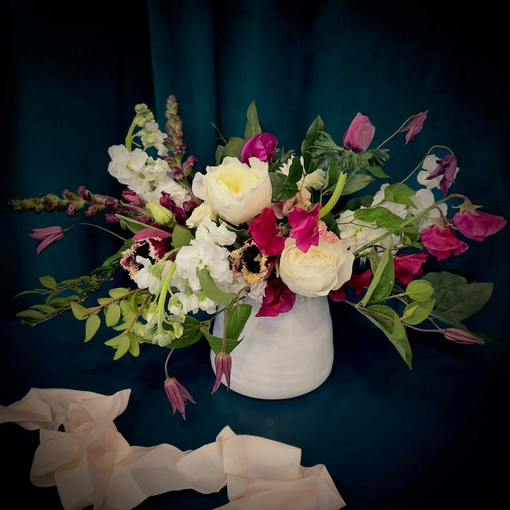 A sweet palette of premium blooms in shades of deep pink and creamy white, Sweet Tart is a beautiful, free flowing floral arrangement designed in a ceramic vase. Perfect for Valentine's Day or any day. Available from Campanula Design Studio in Seattle.