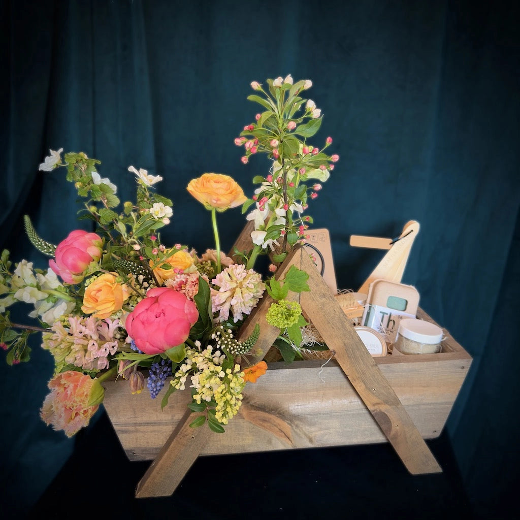 Give this beautiful gift basket of flowers and gardening supplies for that special, customized  Gift. For a birthday,  Mother's Day or any day! Available for Seattle delivery from Campanula Design Studio in Magnolia.