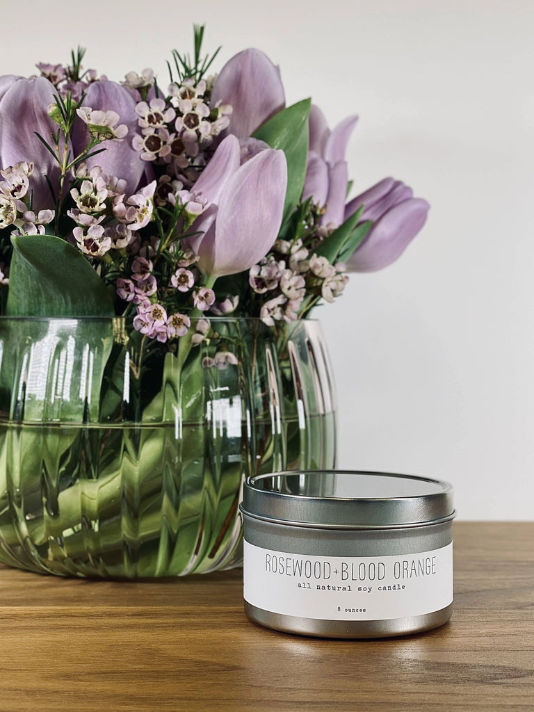 Tin Candle - from the "Citrusy" series from Handmade LaConner. This Rosewood and Blood Orange scented candle is perfect for relaxing candle light. Available from Seattle florist, Campanula Design Studio.