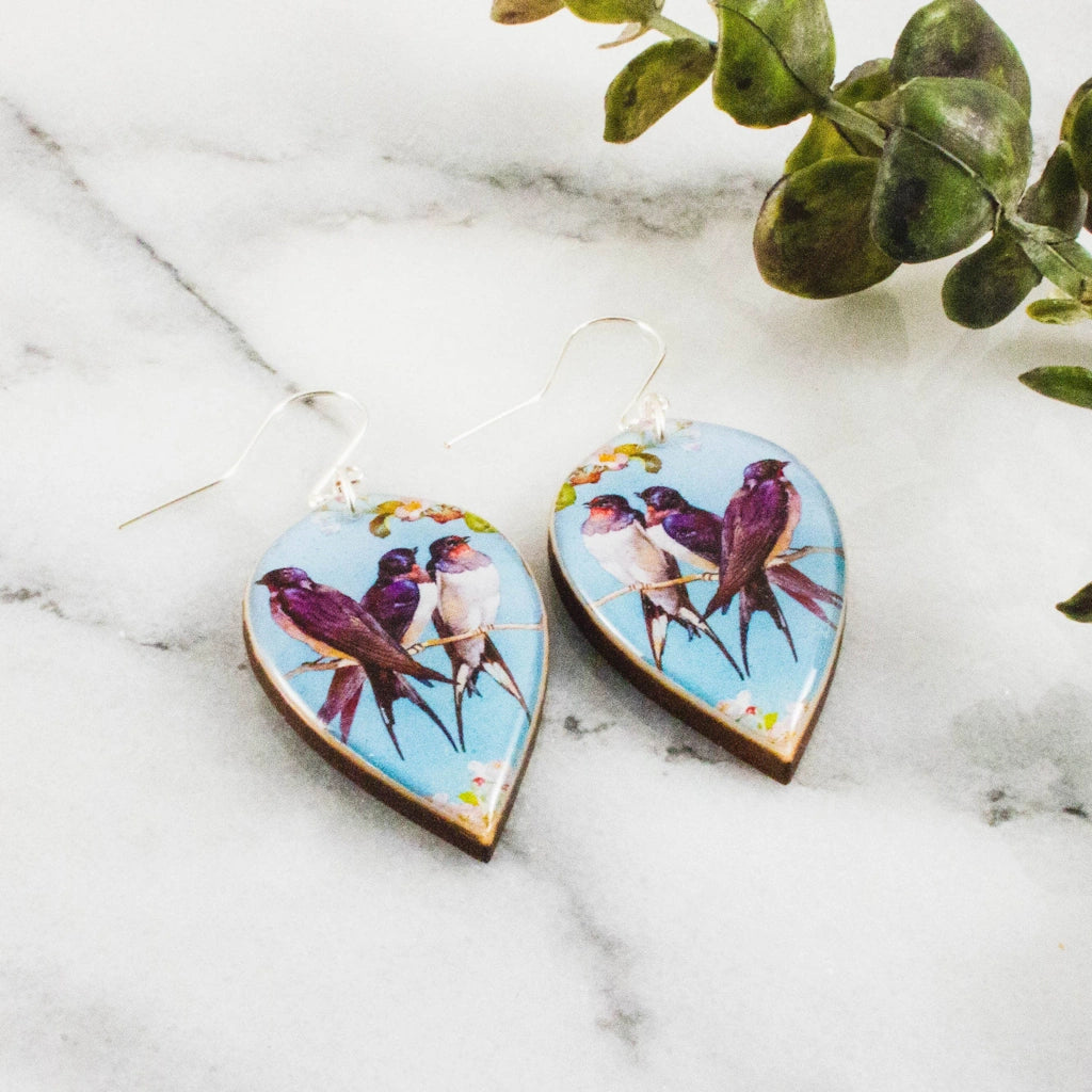 Get ready for spring with these dramatic leaf-shaped earrings. Vintage bird pattern rendered in shades of blue and pink. Stop by our Seattle flower and gift shop in Magnolia, or have them shipped nationwide.