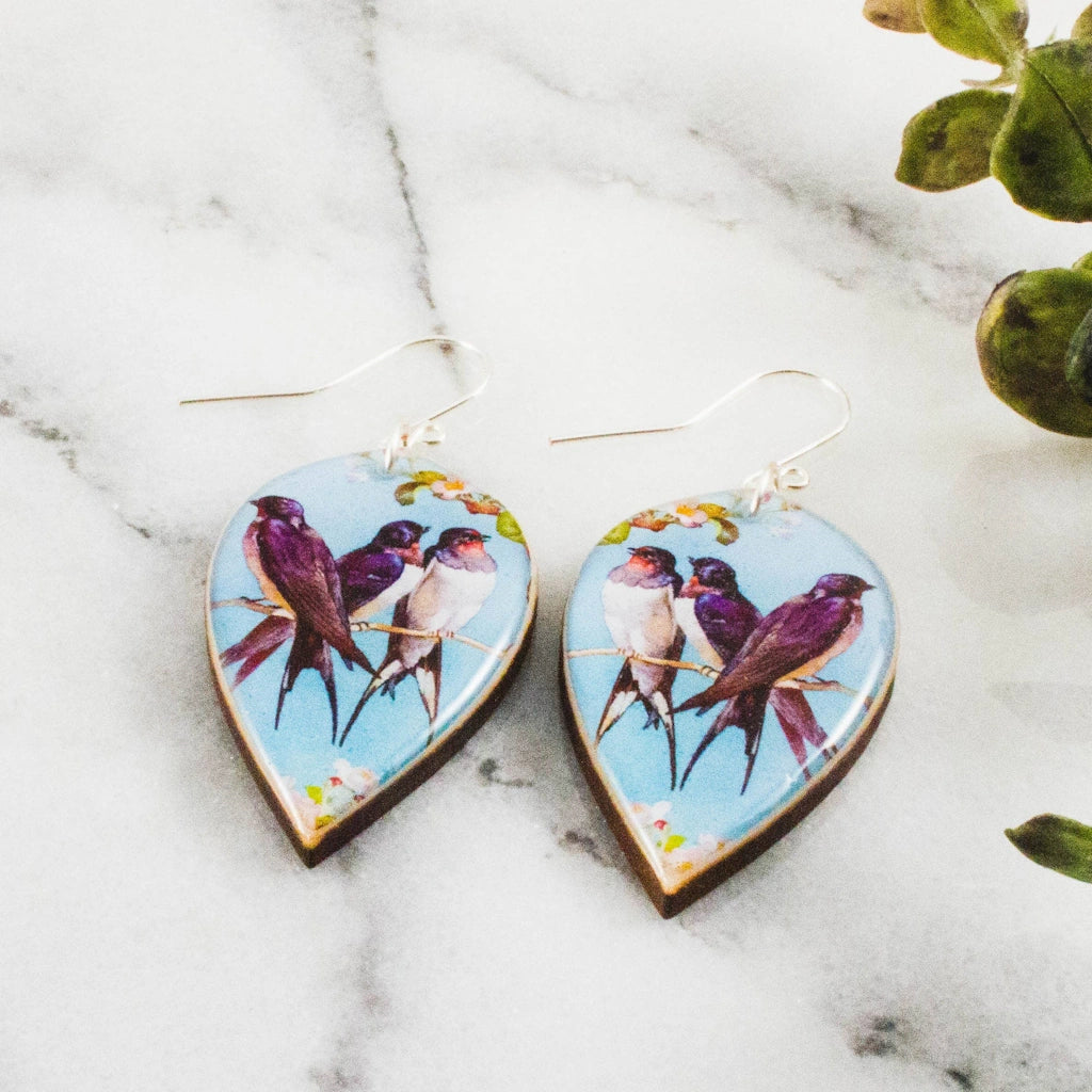 Get ready for spring with these dramatic leaf-shaped earrings. Vintage bird pattern rendered in shades of blue and pink. Stop by our Seattle flower and gift shop in Magnolia, or have them shipped nationwide.