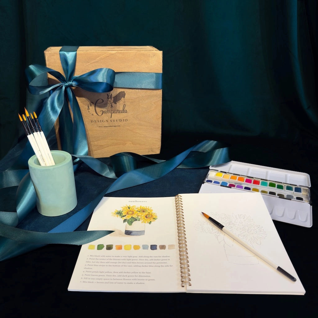 Watercolor book, paints and container gift box for your creative friend. Available from our Seattle Flower shop in Magnolia, nationwide shipping or gift delivery in the greater Seattle area.