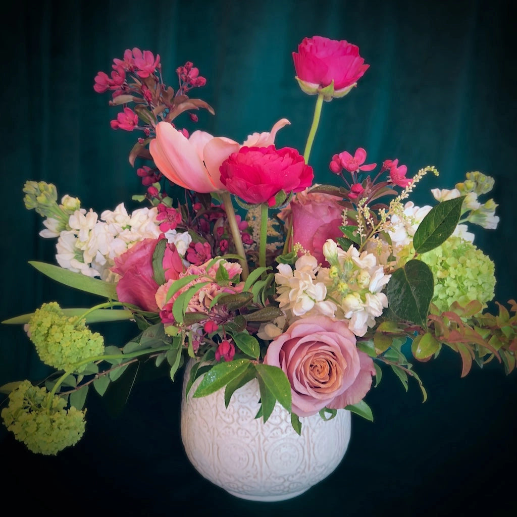 A gorgeous floral in shades of pink and creamy whites designed in a ceramic vase. Available from Campanula Design Studio in Seattle.